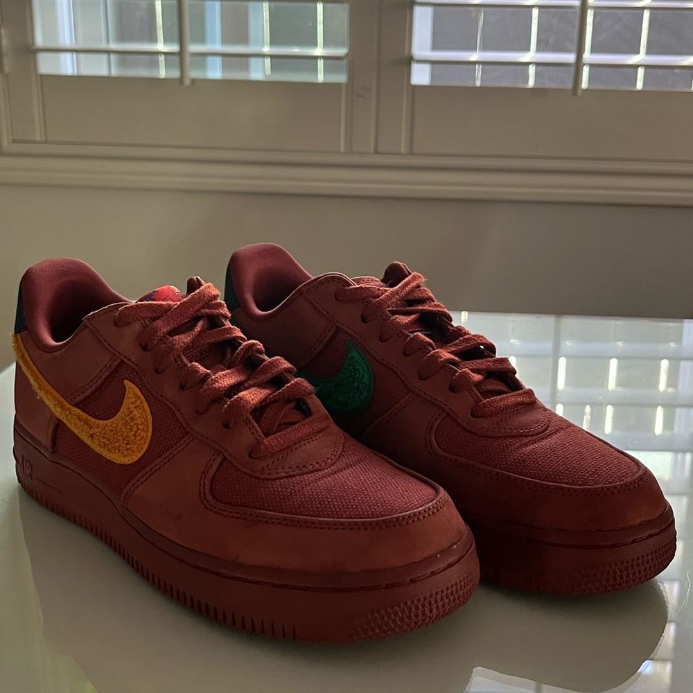 Nike Kids Red Sneakers with Yellow and Green Accents